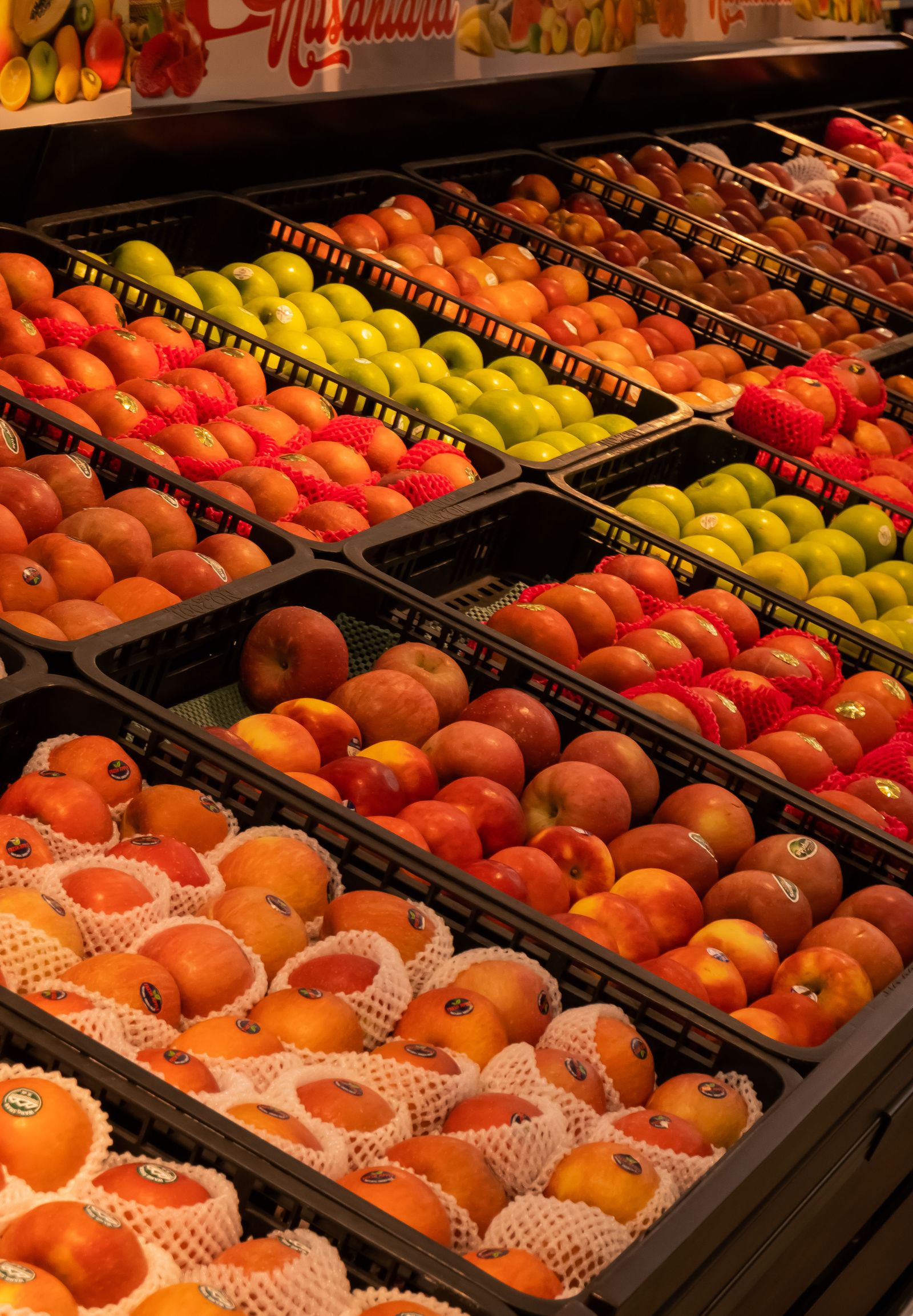 Fresh fruit display in a supermarket aisle