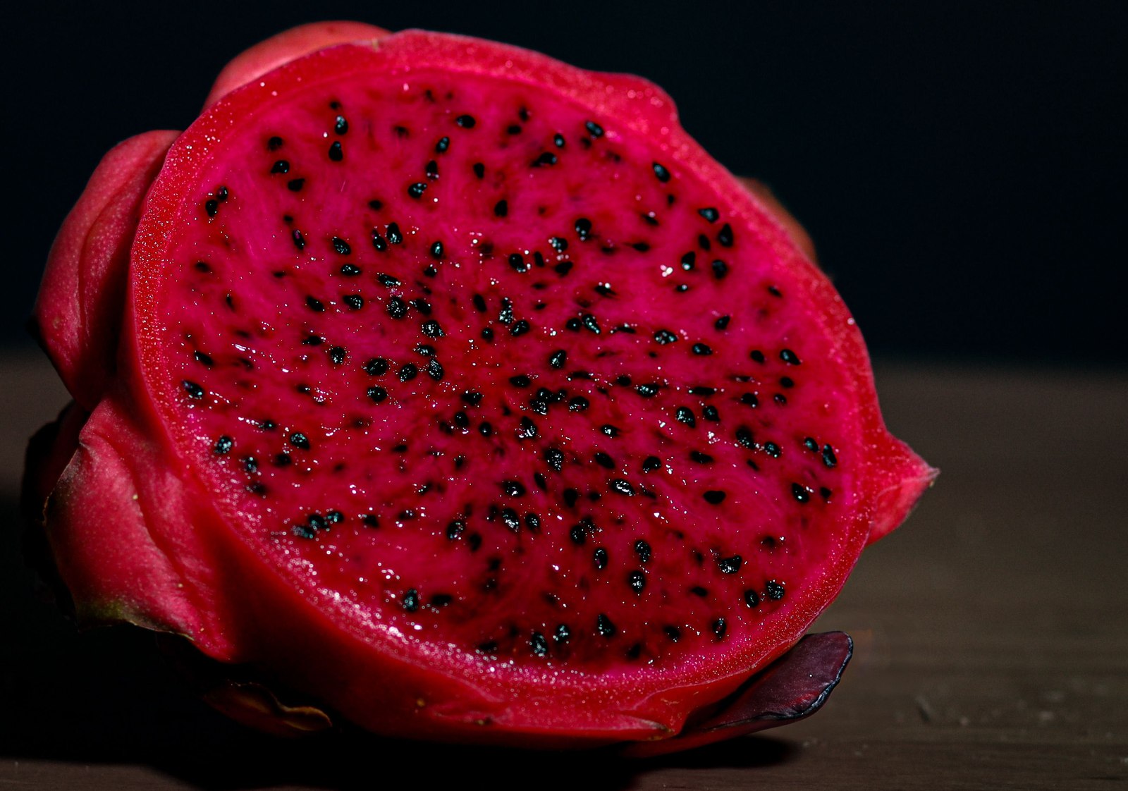 Illustrative dragon fruit photograph; flesh colour and cultivar are not verified.