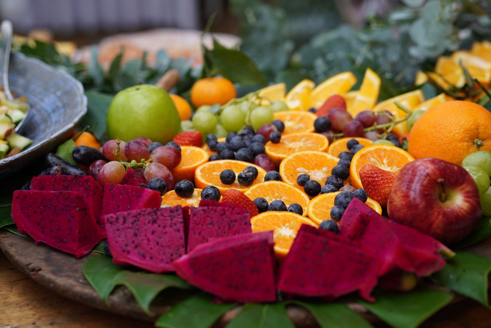 Fresh fruit platter with dragon fruit, grapes and citrus